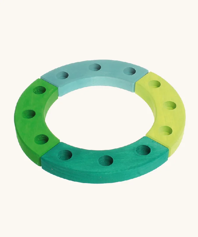 - Rabbit grass rack to prevent waste food boxGrimm's Green-Turquoise 12-Hole Celebration Ring